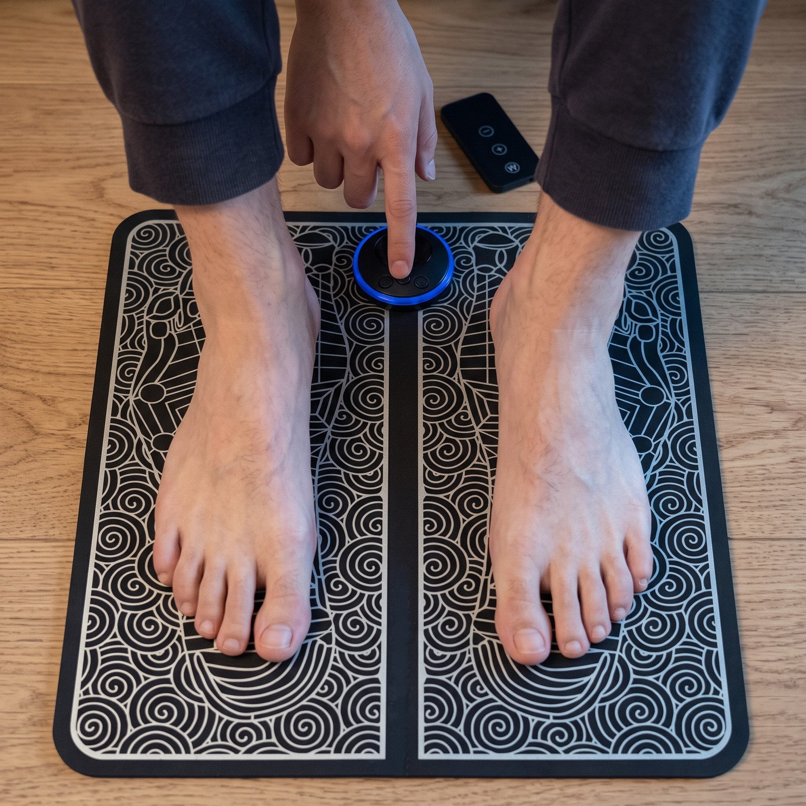 Hand adjusts the FootPause control at the start of a seated session